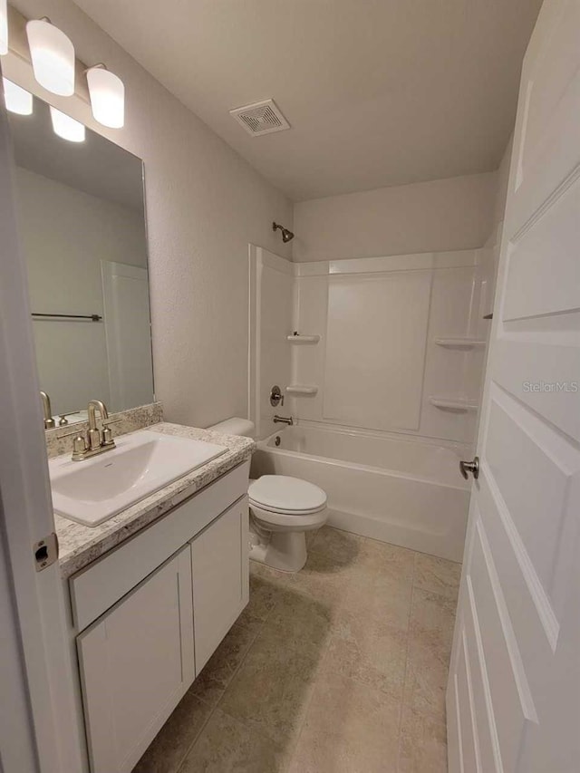 full bathroom featuring toilet, vanity, and  shower combination