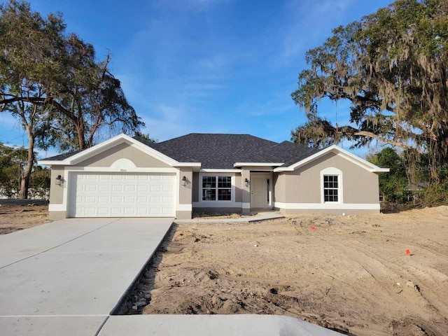 ranch-style house featuring a garage