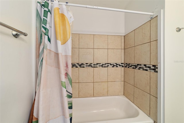 bathroom featuring shower / tub combo with curtain