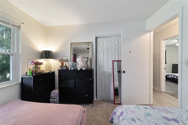 carpeted bedroom with a closet