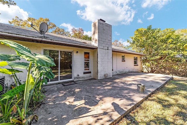 back of property featuring a patio area