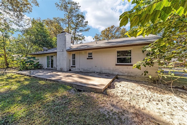 back of house with a patio