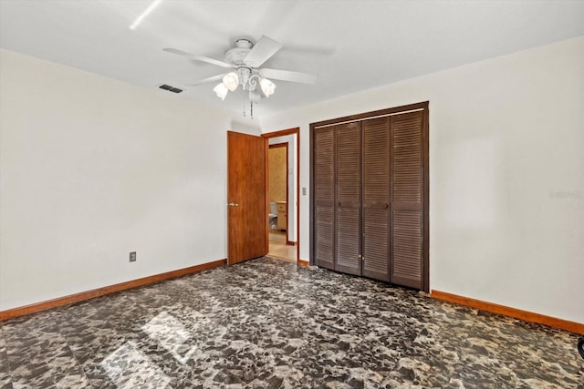 unfurnished bedroom featuring a ceiling fan, baseboards, visible vents, and a closet