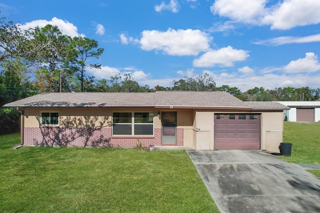 ranch-style home featuring a garage, brick siding, driveway, and a front lawn