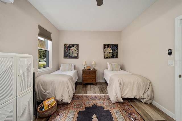 bedroom with ceiling fan, a closet, and dark hardwood / wood-style floors