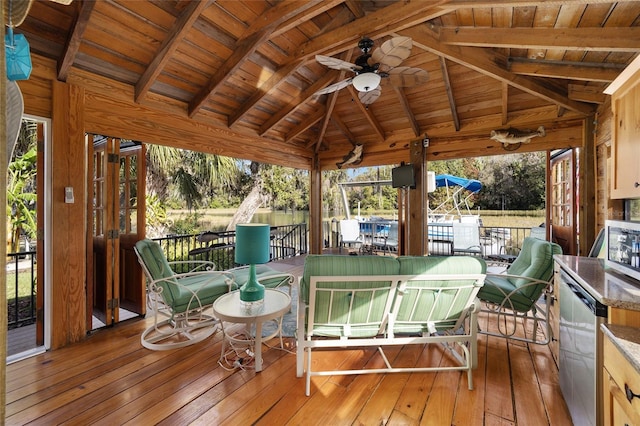 wooden terrace with a gazebo and ceiling fan