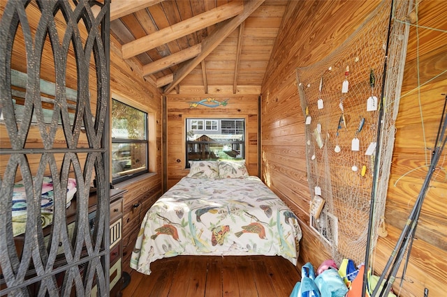 unfurnished bedroom with hardwood / wood-style floors, lofted ceiling with beams, wood ceiling, and wood walls