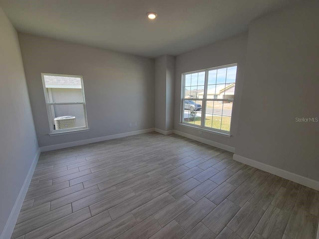 unfurnished room featuring light wood-type flooring