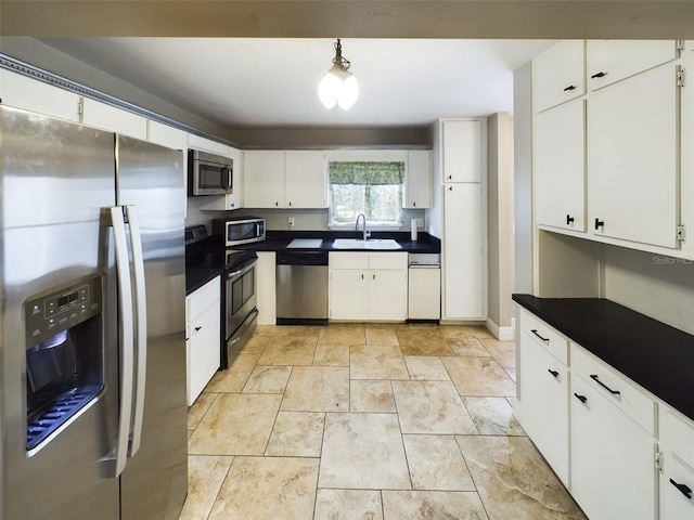 kitchen featuring white cabinets, sink, and appliances with stainless steel finishes