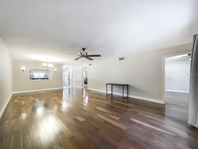 unfurnished living room featuring dark hardwood / wood-style floors and ceiling fan with notable chandelier