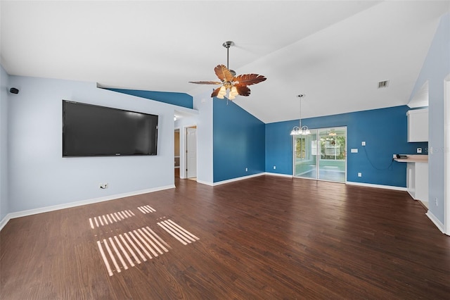 unfurnished living room featuring ceiling fan with notable chandelier, lofted ceiling, and dark wood-type flooring