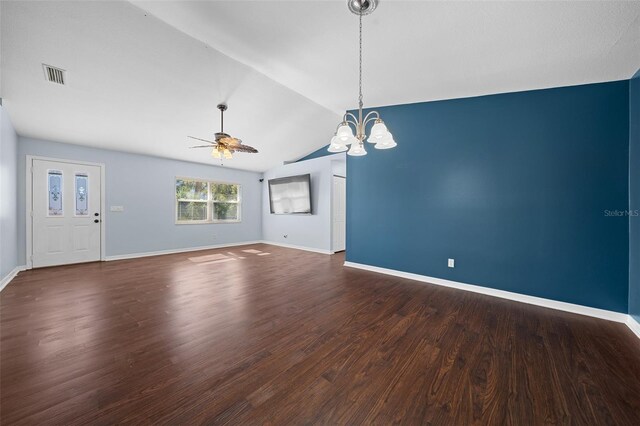 interior space featuring ceiling fan with notable chandelier, dark hardwood / wood-style flooring, and lofted ceiling