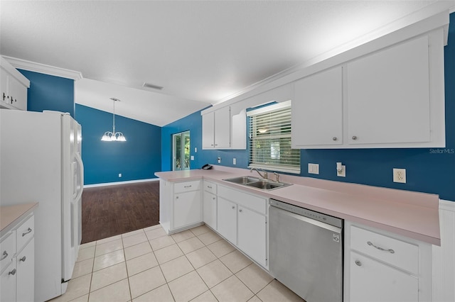 kitchen featuring dishwasher, decorative light fixtures, and white cabinetry