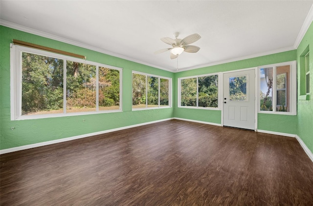 unfurnished sunroom with ceiling fan