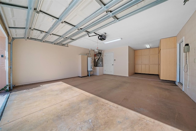 garage with gas water heater and a garage door opener