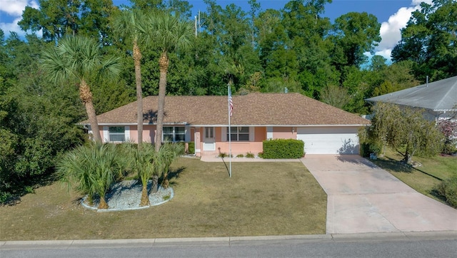 single story home with a front yard and a garage