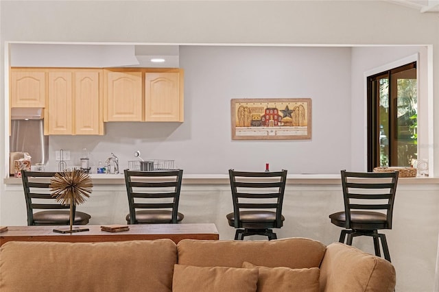 interior space featuring light brown cabinetry