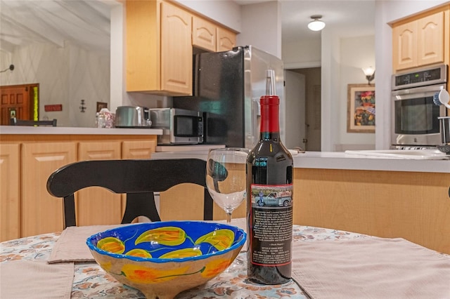 kitchen featuring light brown cabinets and stainless steel appliances