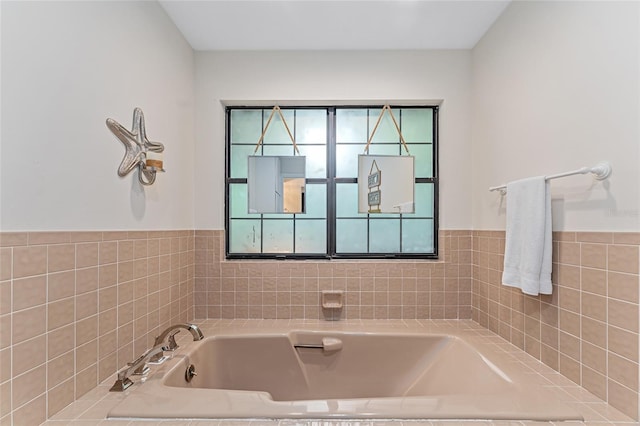 bathroom featuring a tub to relax in