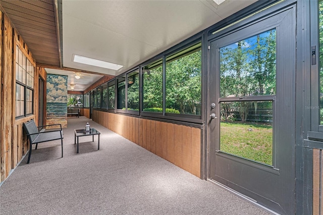 unfurnished sunroom with vaulted ceiling