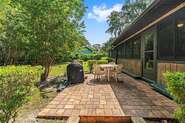 view of patio with a sunroom