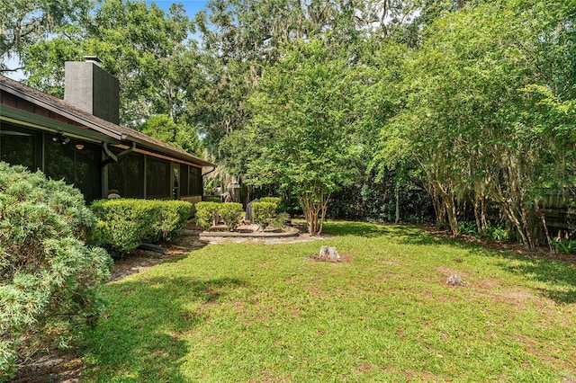 view of yard with a sunroom