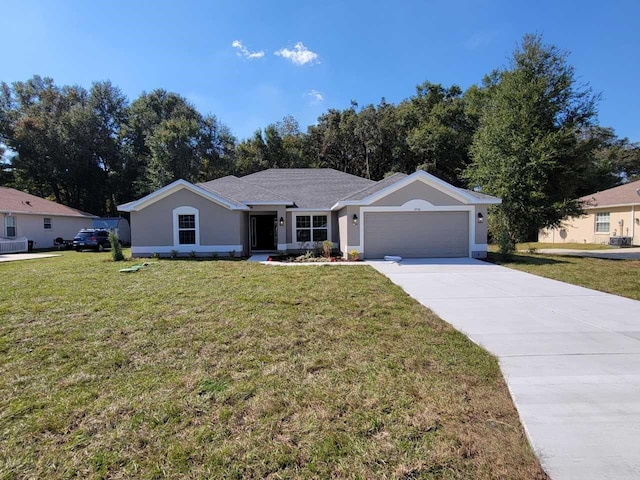 ranch-style home with a front yard and a garage