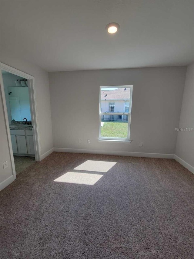 view of carpeted spare room