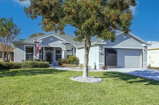 view of front of home with a garage and a front lawn