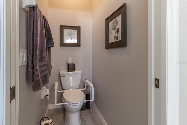 bathroom featuring tile patterned flooring and toilet