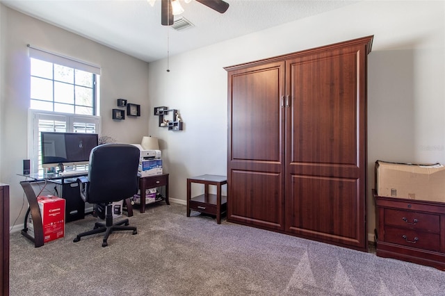 carpeted office with ceiling fan