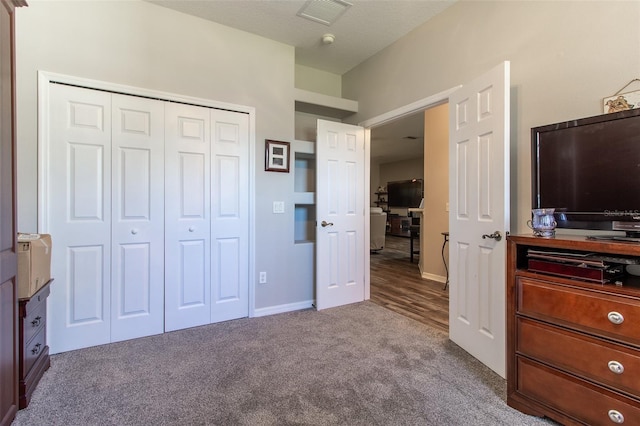 carpeted bedroom featuring a closet