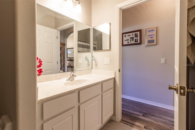 bathroom featuring vanity and wood-type flooring