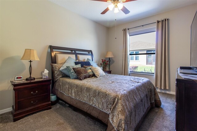 bedroom with ceiling fan and carpet floors