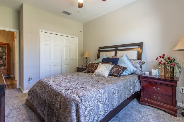 carpeted bedroom featuring a closet and ceiling fan