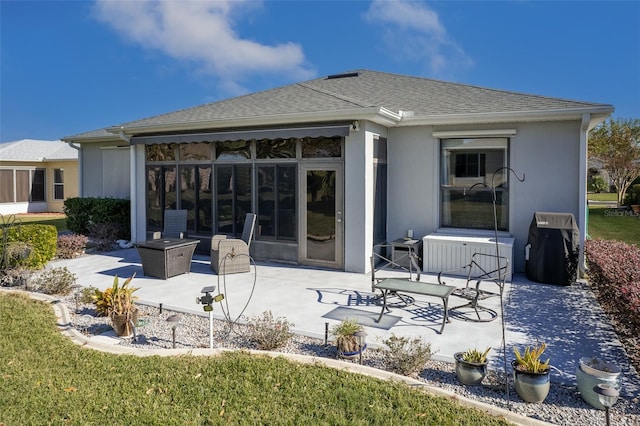 back of house with a patio