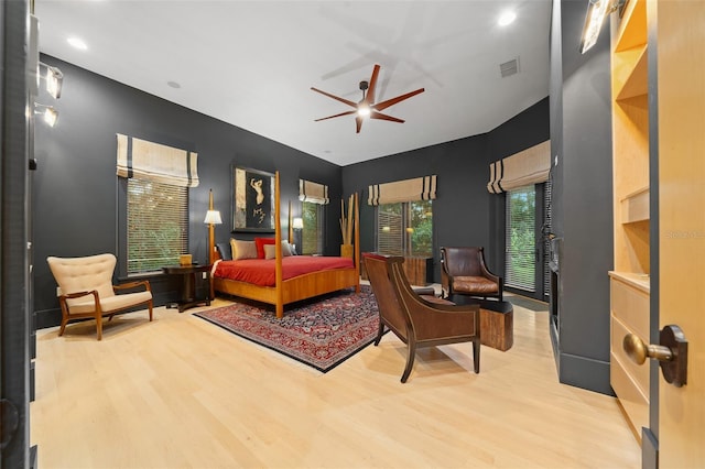 bedroom with hardwood / wood-style flooring and ceiling fan