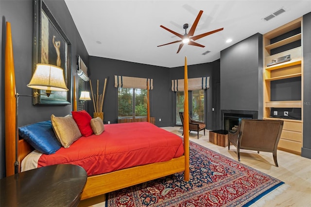 bedroom featuring ceiling fan and light hardwood / wood-style floors