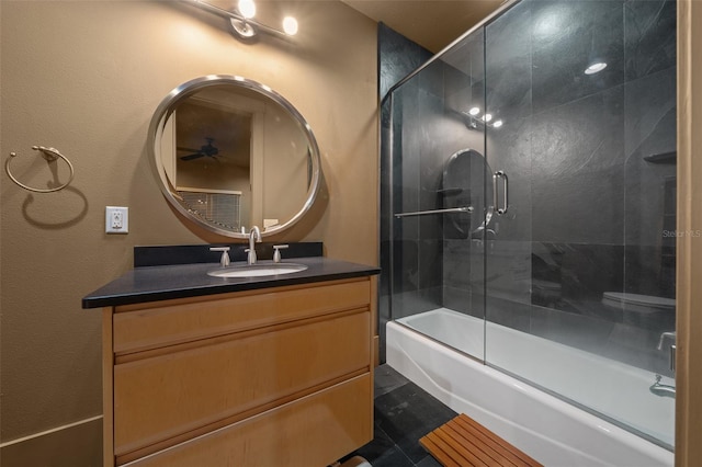 bathroom with vanity and combined bath / shower with glass door