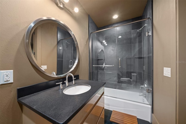 bathroom featuring vanity and enclosed tub / shower combo