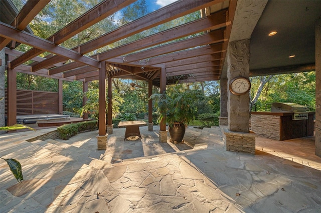 view of patio featuring a pergola, area for grilling, and a grill