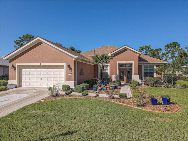 ranch-style house featuring a front yard, french doors, and a garage