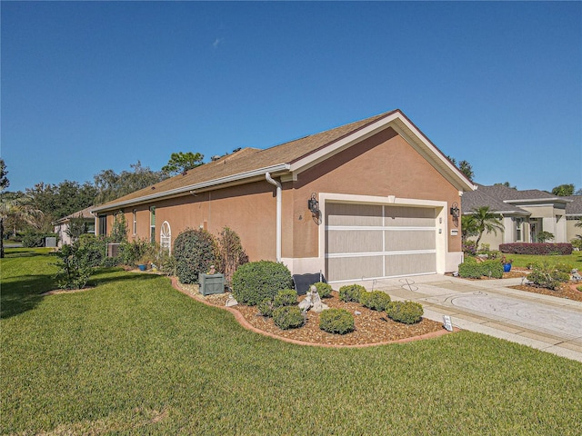 single story home featuring a garage and a front yard