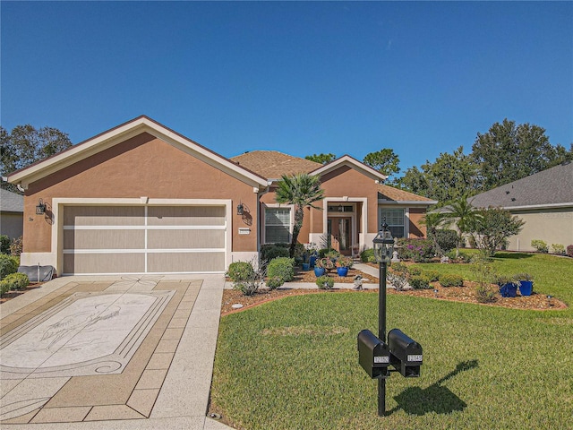 ranch-style house featuring a front lawn and a garage