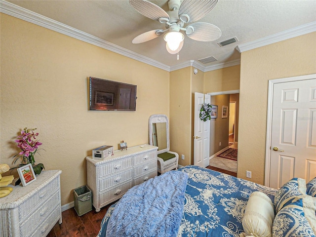 bedroom featuring dark hardwood / wood-style floors, ceiling fan, and ornamental molding