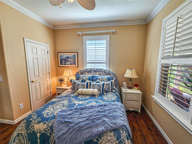 bedroom with a textured ceiling, ceiling fan, dark hardwood / wood-style flooring, and crown molding