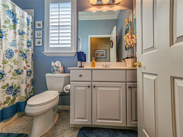 bathroom with tile patterned floors, vanity, toilet, and crown molding