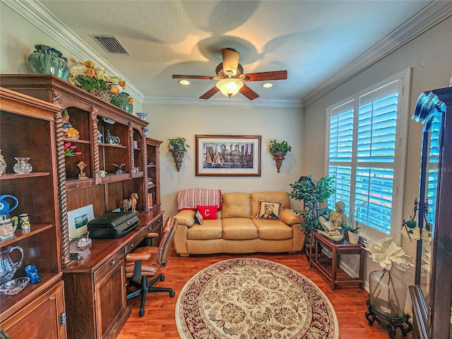 home office with wood-type flooring, ceiling fan, and ornamental molding