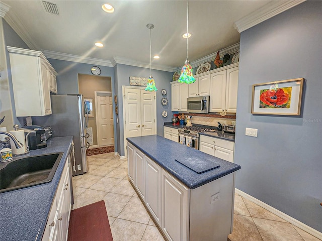 kitchen with crown molding, sink, light tile patterned floors, and stainless steel appliances