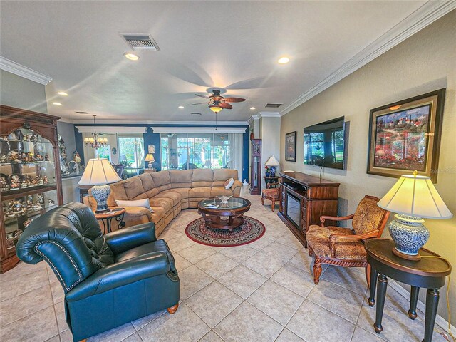 tiled living room featuring ceiling fan with notable chandelier and ornamental molding